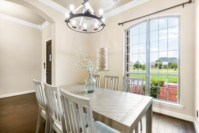 18044 Langford Ln, Talty, TX 75126 - dining area featuring a chandelier, ornamental molding, wood-type flooring, and arched walkways
