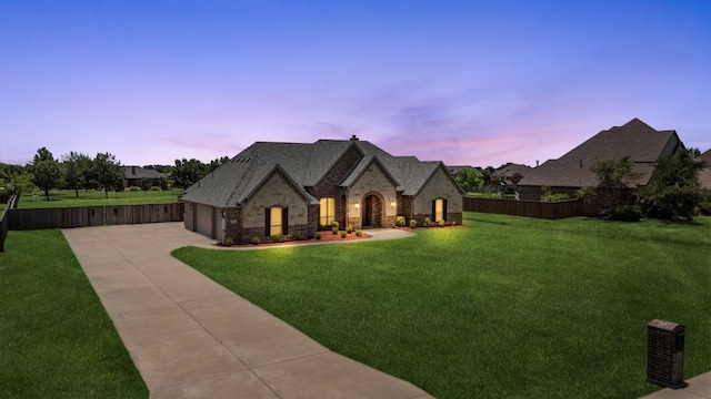 18044 Langford Ln, Talty, TX 75126 - french provincial home with stone siding, driveway, and an attached garage