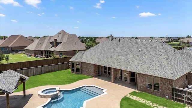 18044 Langford Ln, Talty, TX 75126 - view of swimming pool with a residential view, a fenced backyard, a pool with connected hot tub, and a patio area