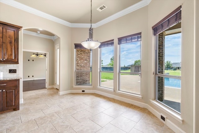 18044 Langford Ln, Talty, TX 75126 - unfurnished dining area featuring ornamental molding and arched walkways
