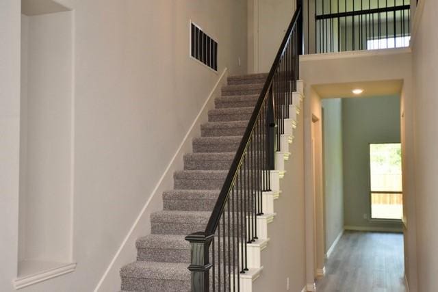 2605 Donella Dr, Denton, TX 76207 - stairs with wood finished floors and baseboards