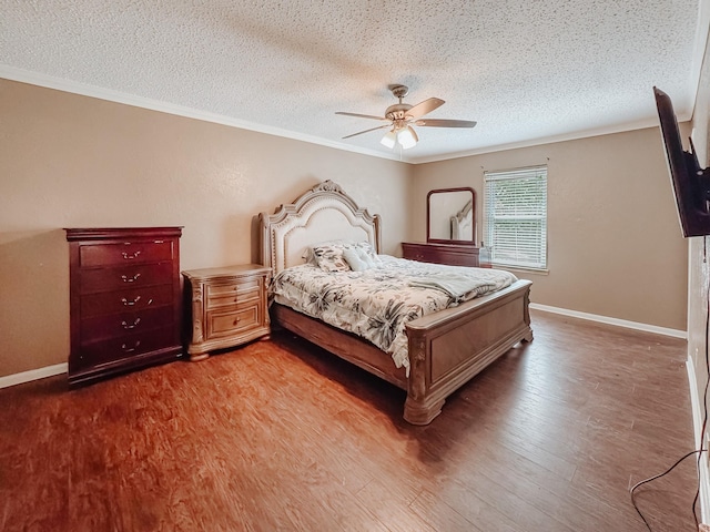 3112 Louis Ave, Corsicana, TX 75110 - bedroom featuring a textured ceiling, ornamental molding, wood finished floors, and a ceiling fan