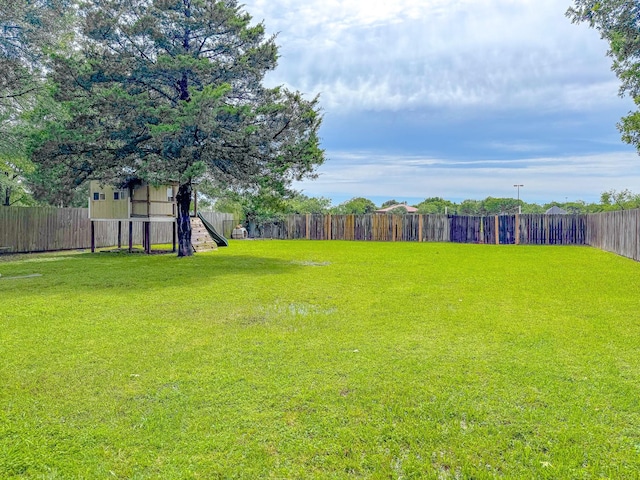 3112 Louis Ave, Corsicana, TX 75110 - fenced backyard with a playground