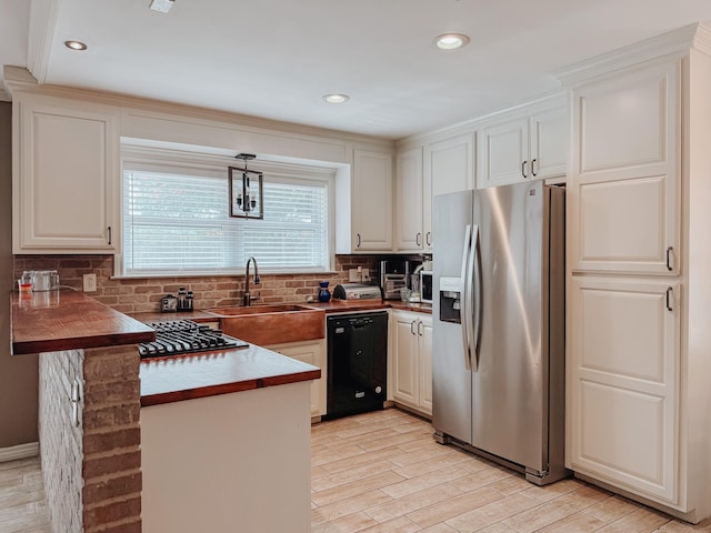 3112 Louis Ave, Corsicana, TX 75110 - kitchen featuring stainless steel refrigerator with ice dispenser, black dishwasher, a peninsula, light wood finished floors, and decorative backsplash