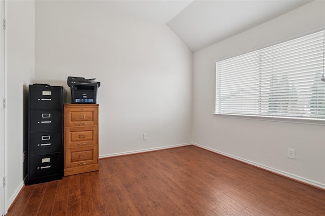 8506 Linda Vista Dr, Rowlett, TX 75088 - unfurnished bedroom featuring dark wood-style flooring and lofted ceiling