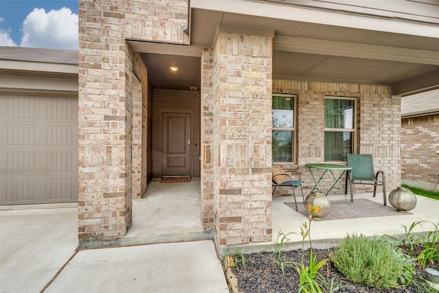 632 Peshtigo Rd, Justin, TX 76247 - property entrance featuring covered porch, a garage, and brick siding