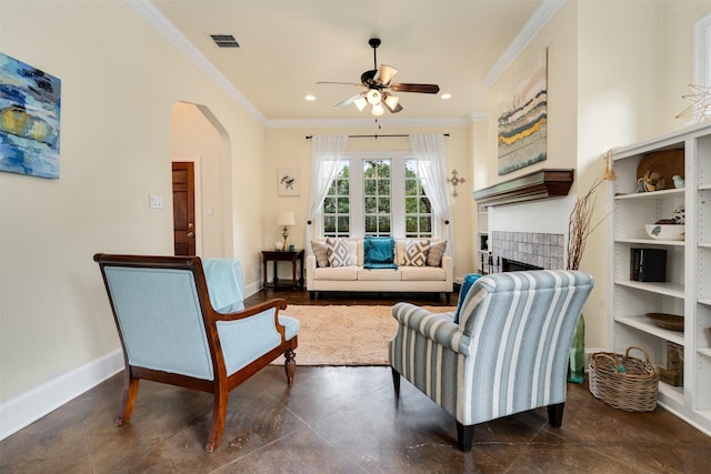 2309 Ryan Ave, Fort Worth, TX 76110 - living area with ornamental molding, a ceiling fan, arched walkways, a tile fireplace, and recessed lighting