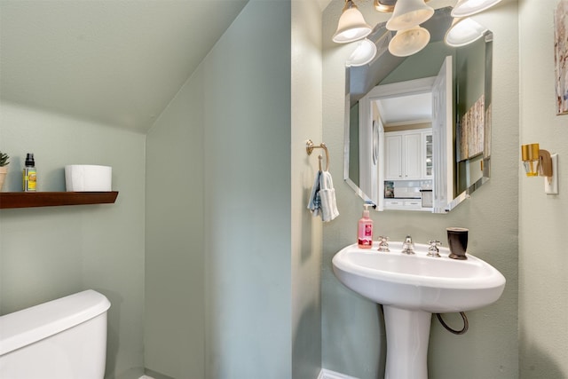2309 Ryan Ave, Fort Worth, TX 76110 - bathroom with a chandelier and vaulted ceiling
