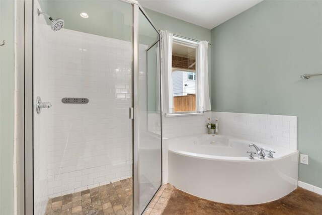 2309 Ryan Ave, Fort Worth, TX 76110 - bathroom featuring a stall shower and a bath