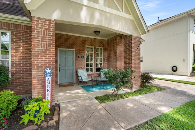 2309 Ryan Ave, Fort Worth, TX 76110 - entrance to property with covered porch, brick siding, and roof with shingles