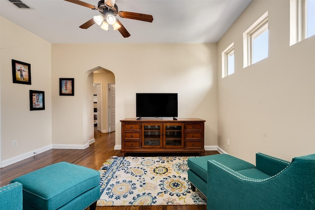 2309 Ryan Ave, Fort Worth, TX 76110 - living area with arched walkways, ceiling fan, and wood finished floors