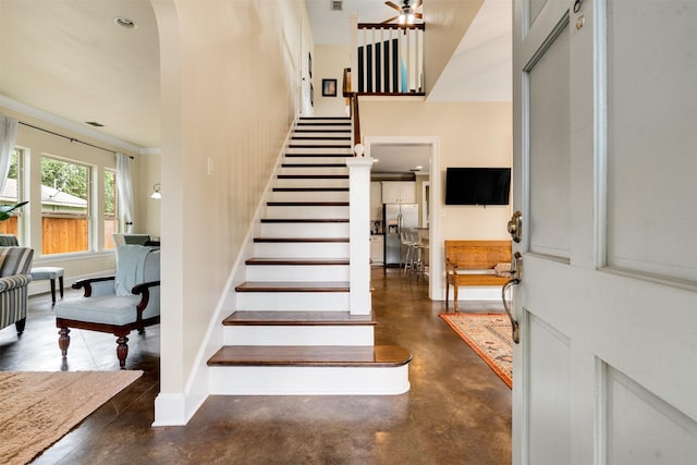 2309 Ryan Ave, Fort Worth, TX 76110 - stairway with concrete floors and ceiling fan