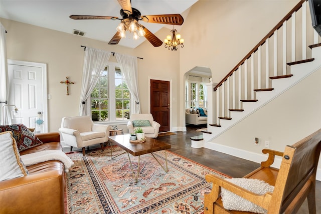 2309 Ryan Ave, Fort Worth, TX 76110 - living room featuring a ceiling fan, arched walkways, stairs, concrete floors, and lofted ceiling