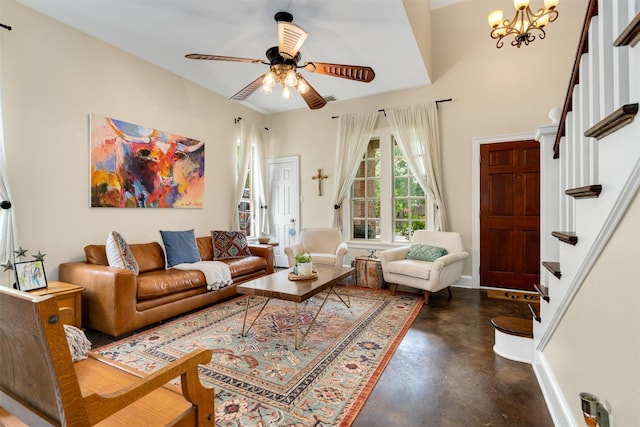 2309 Ryan Ave, Fort Worth, TX 76110 - living room featuring concrete flooring, stairs, ceiling fan, and a chandelier