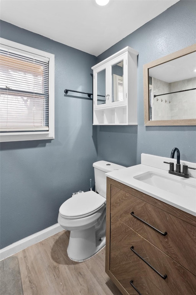 310 Lexington Ave, Abilene, TX 79605 - full bathroom featuring wood finished floors, vanity, and a shower