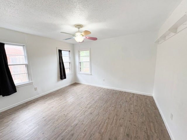 310 Lexington Ave, Abilene, TX 79605 - spare room with wood finished floors, a textured ceiling, and a ceiling fan