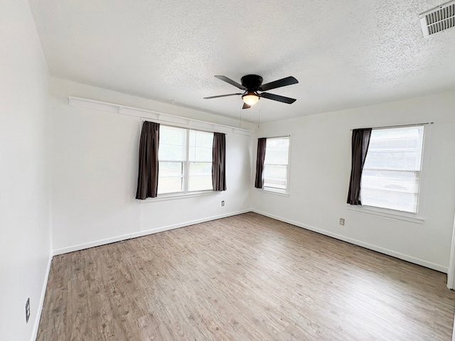 310 Lexington Ave, Abilene, TX 79605 - spare room featuring a textured ceiling, ceiling fan, and wood finished floors