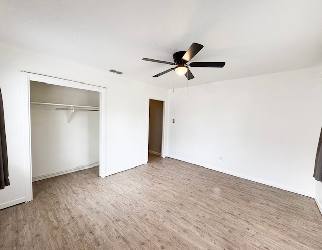 310 Lexington Ave, Abilene, TX 79605 - unfurnished bedroom with wood finished floors, a closet, and a ceiling fan