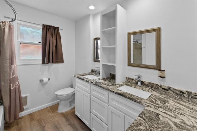 310 Lexington Ave, Abilene, TX 79605 - full bathroom with double vanity, wood finished floors, and a shower with shower curtain