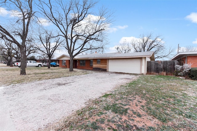 310 Lexington Ave, Abilene, TX 79605 - ranch-style house with gravel driveway and a garage