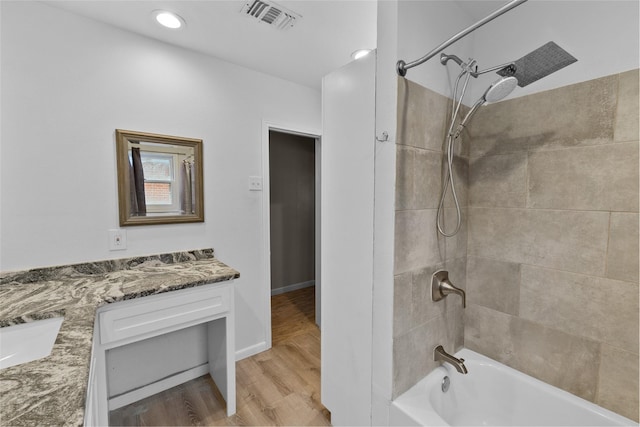310 Lexington Ave, Abilene, TX 79605 - bathroom featuring shower / washtub combination, vanity, wood finished floors, and recessed lighting