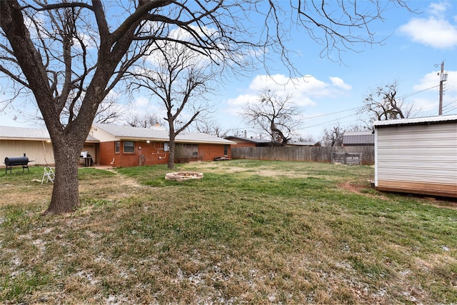 310 Lexington Ave, Abilene, TX 79605 - view of yard with an outdoor fire pit and an outdoor structure