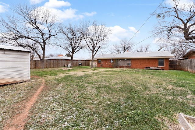 310 Lexington Ave, Abilene, TX 79605 - fenced backyard with a storage unit