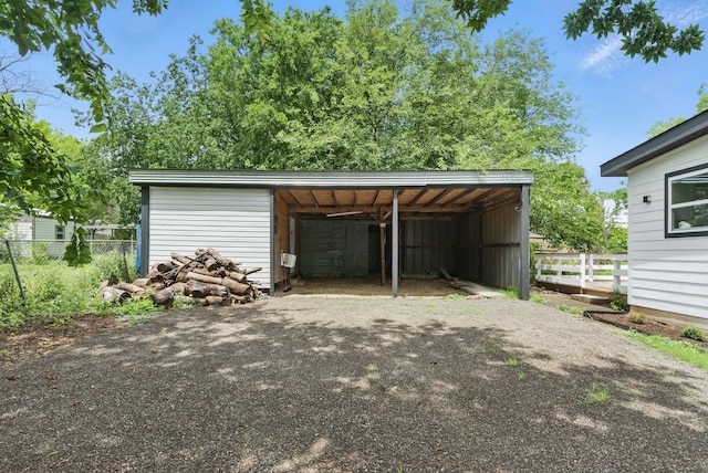 903 N Miller St, Decatur, TX 76234 - garage with asphalt driveway and a carport