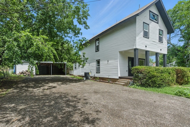903 N Miller St, Decatur, TX 76234 - view of property exterior with asphalt driveway and covered porch