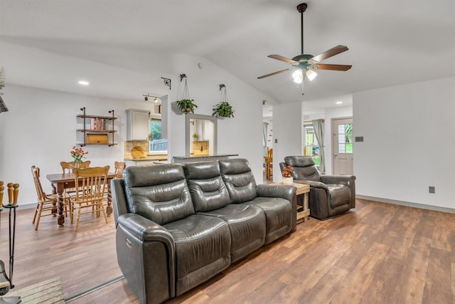 1737 Live Oak Ct, Lewisville, TX 75067 - living area featuring ceiling fan, vaulted ceiling, wood finished floors, and recessed lighting