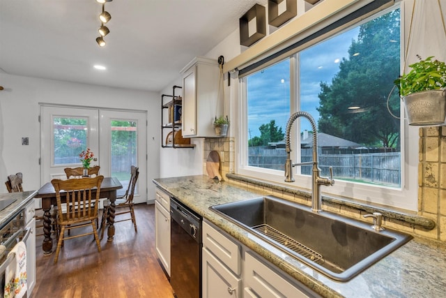1737 Live Oak Ct, Lewisville, TX 75067 - kitchen featuring dishwasher, dark wood finished floors, white cabinetry, light stone counters, and wall oven