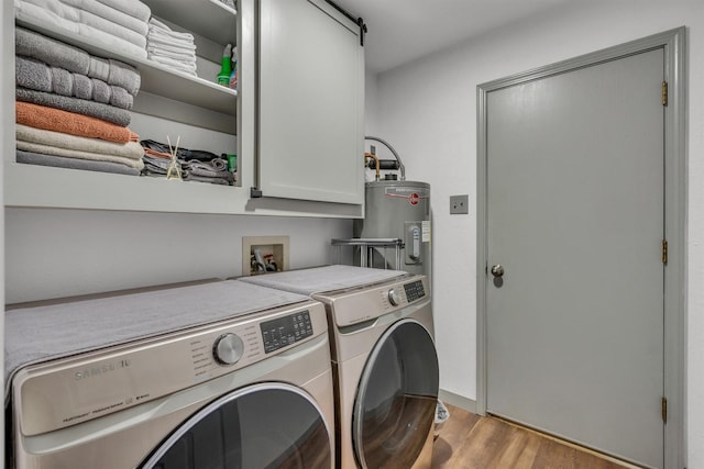 1737 Live Oak Ct, Lewisville, TX 75067 - washroom with cabinet space, wood finished floors, washing machine and dryer, and water heater