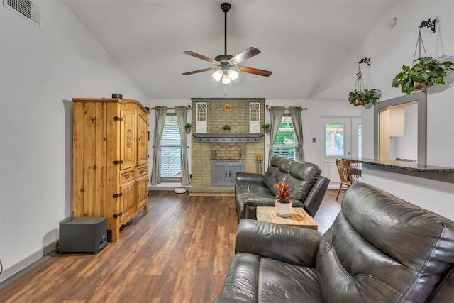 1737 Live Oak Ct, Lewisville, TX 75067 - living room featuring ceiling fan, high vaulted ceiling, a fireplace, and wood finished floors