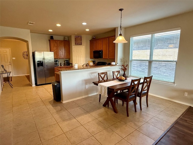 1117 Prairie Heights Dr, Fort Worth, TX 76108 - dining space featuring arched walkways, recessed lighting, and light tile patterned floors
