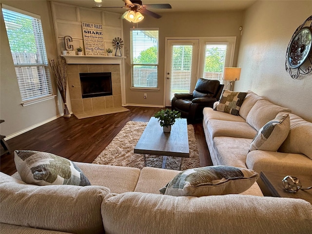 1117 Prairie Heights Dr, Fort Worth, TX 76108 - living room featuring wood finished floors, a ceiling fan, and a tile fireplace