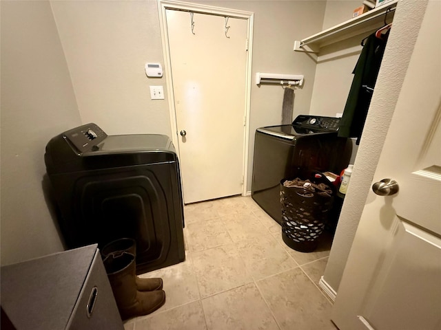 1117 Prairie Heights Dr, Fort Worth, TX 76108 - laundry room featuring washer and clothes dryer and light tile patterned flooring