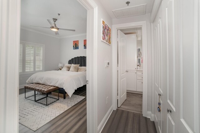 3400 Welborn St Unit 224, Dallas, TX 75219 - bedroom featuring dark wood-type flooring, crown molding, and ceiling fan