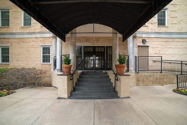 3400 Welborn St Unit 224, Dallas, TX 75219 - property entrance featuring french doors and brick siding