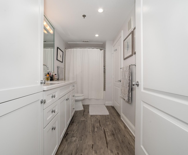 3400 Welborn St Unit 224, Dallas, TX 75219 - full bathroom with vanity, recessed lighting, wood finished floors, and shower / bathtub combination with curtain