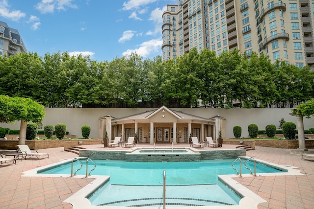 3400 Welborn St Unit 224, Dallas, TX 75219 - community pool with a hot tub and a patio area
