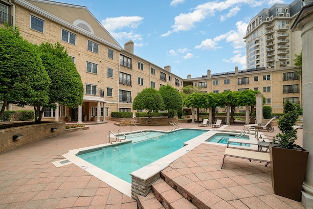 3400 Welborn St Unit 224, Dallas, TX 75219 - community pool featuring a patio and a hot tub