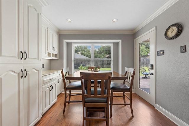 9600 Old Farm Rd, Woodway, TX 76712 - dining space with plenty of natural light, hardwood / wood-style floors, a textured wall, ornamental molding, and recessed lighting