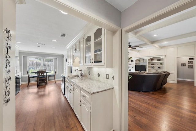9600 Old Farm Rd, Woodway, TX 76712 - kitchen with glass insert cabinets, dishwasher, dark wood finished floors, light stone countertops, and recessed lighting