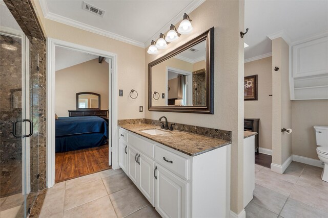 9600 Old Farm Rd, Woodway, TX 76712 - ensuite bathroom with vanity, tile patterned flooring, a stall shower, and ornamental molding