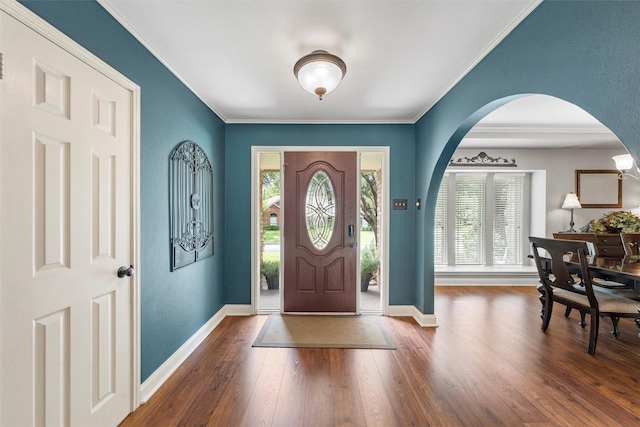 9600 Old Farm Rd, Woodway, TX 76712 - foyer featuring arched walkways, crown molding, and wood finished floors