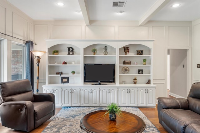 9600 Old Farm Rd, Woodway, TX 76712 - living area featuring a decorative wall, light wood finished floors, beamed ceiling, recessed lighting, and built in features