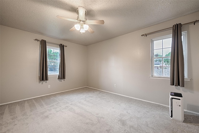 531 Himes Dr, Euless, TX 76039 - carpeted empty room featuring a textured ceiling and a ceiling fan