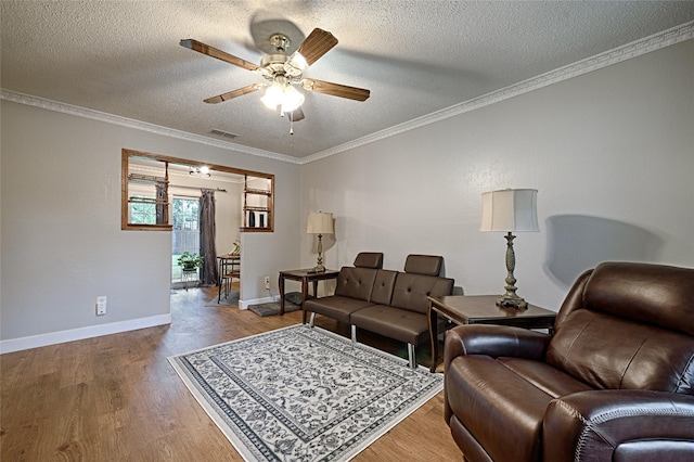 531 Himes Dr, Euless, TX 76039 - living area with ceiling fan, a textured ceiling, wood finished floors, and crown molding