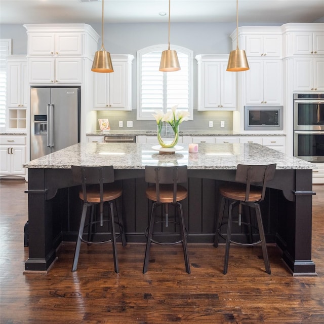 13896 Evergreen Dr, Frisco, TX 75035 - kitchen with appliances with stainless steel finishes, white cabinets, and tasteful backsplash