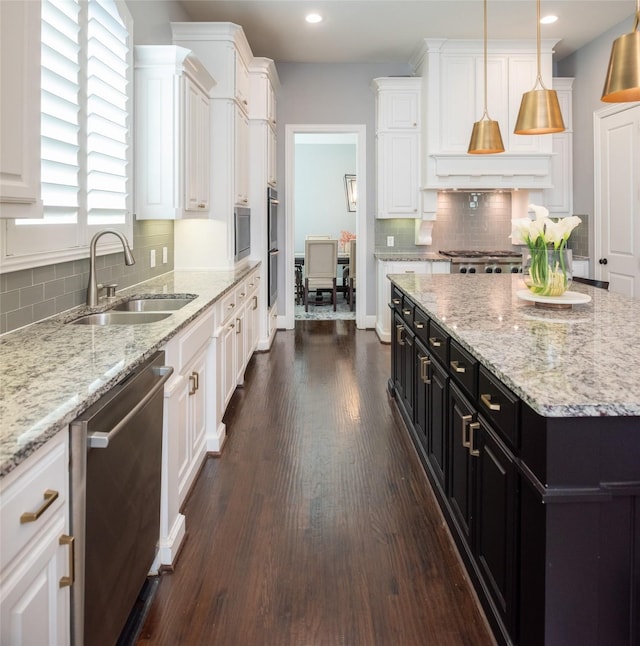 13896 Evergreen Dr, Frisco, TX 75035 - kitchen with stainless steel appliances, dark cabinetry, white cabinets, dark wood-type flooring, and decorative backsplash